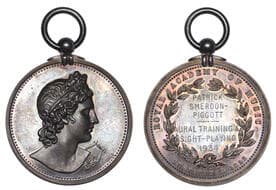 British Historical Medals from Various Properties
Royal Academy of Music, a silver award medal by J. Pinches, bust...