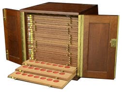 Coin Cabinets and Books from Various Properties
A wooden cabinet by Peter Nichols, 30 x 30 x 31cm, comprising 27...