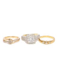 Set of three mixed 9 and 10 carat rings A 9 carat yellow gold trilogy ring. The ring features 3 round cut diamonds....
