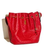 Vintage Yves Saint Laurent 'Arabesque' Embossed Leather Bucket Bag in Red A vintage Yves Saint Laurent (YSL)...
