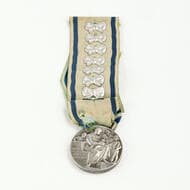 Italy, Mother's Medal for Eight Children, 1939 Est. Medal 36mm, by the Italian Royal Mint, with eight bows attached to...