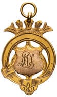 U & B Greeks Tennis Tournament, 1912, gVF 9ct gold fob medal in the form of ornate shield with pierced details, size...