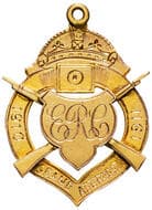 E.R.C (Rifle Club) - Grand Aggregate, 1910 - 1911, aUNC 9ct gold fob medal, ornate shield form with crossed rifles &...