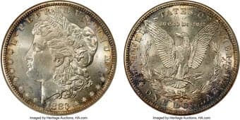 Morgan Dollars 1883-S $1 MS65 NGC. Intermittent gold toning graces the obverse margin while deep bluish-gray patina...