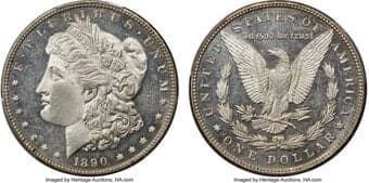 Morgan Dollars 1890 $1 MS65 Deep Mirror Prooflike PCGS. Slight blue-steel hues highlight the reflective surfaces of...