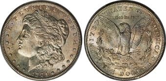 Morgan Dollars 1904-S $1 MS65 PCGS. Apricot and russet-gold surfaces overlay a base of steel-blue and silver. Striking...