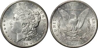 Morgan Dollars 1904-S $1 MS62 PCGS. Alluring, lightly frosted silver envelops this piece, accompanied by an enamoring...