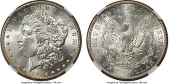 Morgan Dollars 1904-S $1 MS64 NGC. Blinding, satiny cartwheel luster dominates both sides, and is far above average for...