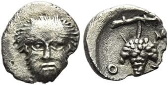 Thessaly, Scotussa Hemiobol circa 425-400, AR 8 mm, 0.33 g. Head of Heracles facing. Rev. Σ-K-O Bunch of grapes...