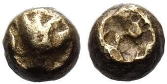 Ionia, Uncertain mint 1/96 stater circa 600-550, EL 3 mm, 0.15 g. Lion paw seen from above. Rev. Rough incuse square...